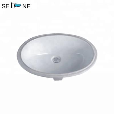 China Fashion Modern Design Trend Oval Ceramic Bathroom Under Mount Hand Sink for sale