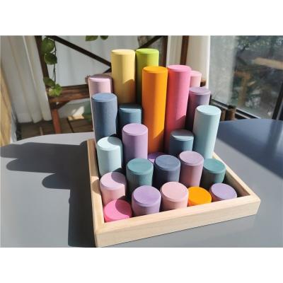 China 100% Eco-Friendly Basswood Pastel Large Stacking Cylinders Building Block Wooden Rollers Toys With Tray Kids Creative Play for sale