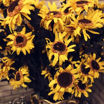 China Conveniently Wholesale Cheap Artificial Plastic Sunflower Long Flower 5 Heads Stem For Table Wedding Centerpiece DIY Home Decoration for sale