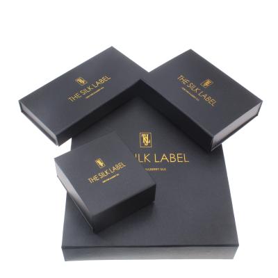 China Recycled Materials Unique Customized Made Paper Boxes Black Folding Book Boxes Rigid Gift Packaging With Gold Stamping For Cosmetics for sale