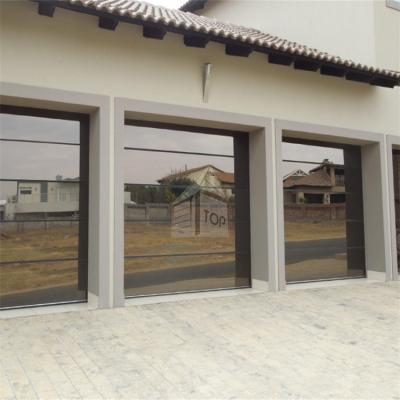 China Mirror aluminum alloy waterproof film coated glass garage door villa frosted glass garage door for sale