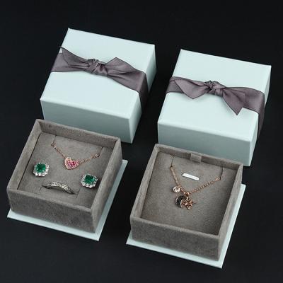 China High End Cardboard Cardboard Jewelry Packaging Boxes Can Luxury Customized Ring Jin Bracelet Necklaces Jewelry Box With Bow for sale