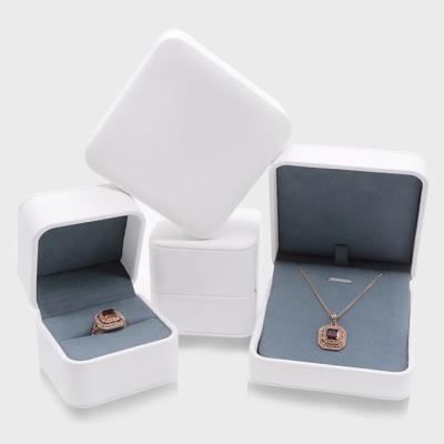 China Luxury PU Leather+Plastic High Quality Pendant White Ring Box Custom Made Leather Ring Jewelry Box Wedding Jewelry Boxes With Logo for sale