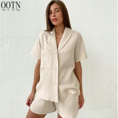 China OOTN 2022 Breathable Elastic Waist Wide Shorts Women Fits Irregular Collar Button Casual Shirts Ease 2 Piece Shorts Set Cotton Apricot for sale