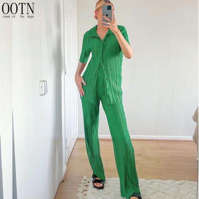 China OOTN Breathable Women Green Long Pants Suits Holiday Elastic Short Sleeve Tops Woman 2022 2 Pieces Suits Summer Pleated Pants Set for sale