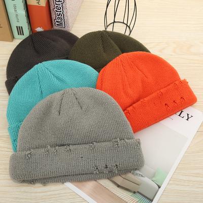 China JOINT Custom Fashion Hip Hop Hole Beanie Men Women Knitted Bowler Winter Broken Hat for sale