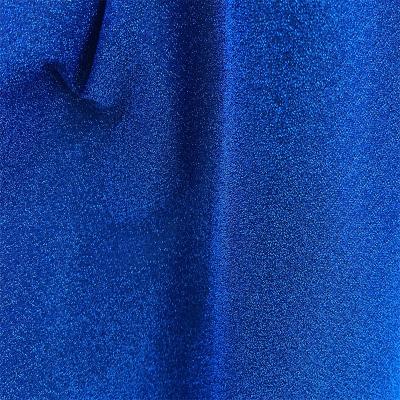 China Flash Fluorescent Glitter Fabric Polyester Knitting Metallic Silk Fabric Can Be Used For Casual Dress Wedding Stage for sale