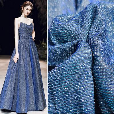 China Fluorescent made in china royal blue shiny knitted fabric glitter fabric for women's wedding dress ball gown for sale