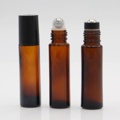 China Cosmetic Wholesale Essential Oil Roller Bottle Amber Frosted Different Cap Roll On Glass Bottle for sale