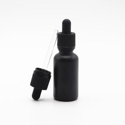 China Custom Logo 1oz Cbd Oil Tincture Glass Bottle Matte Black Frosted Glass Cosmetic Dropper Bottle With Child Safe Plastic Lid for sale