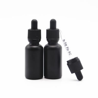 China Wholesale Cosmetic Personal Care cbd oil tincture bottle 30ml black frosted glass dropper bottle with child proof measuring dropper cap for sale