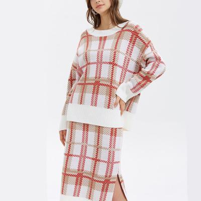 China Anti-wrinkle 2021 winter fashionable women knitted dress 2 piece sweater set plaid jacquard sleeve crewneck jumper tops long and mid skirt for sale