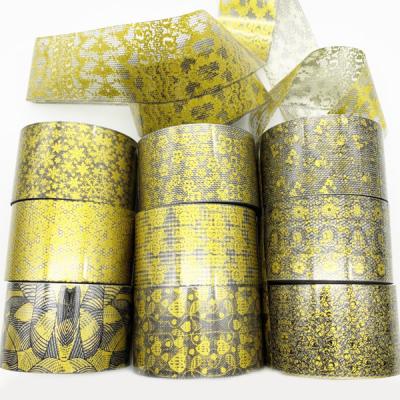 China Luxury PET Gold Lace Nail Stickers Gold Snowflake Foil Sticker for sale