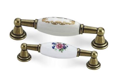 China Zinc + Ceramic Material Replacement Kitchen Cabinet Handles Brass Finish for sale