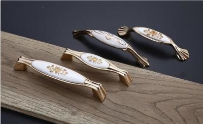 China Luxury Zinc Alloy + Ceramic Material Handles For Kitchen Cupboards And Drawers for sale