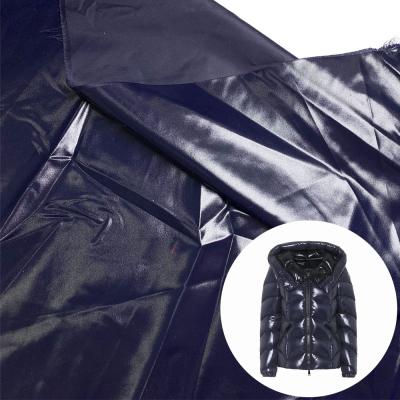 China 40D 100% waterproof nylon raincoat fabric, super soft and bright fabrics for down jackets for sale