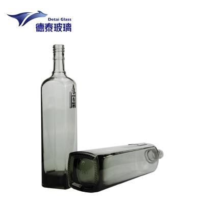 China Liquor Wine Storage Factory Supply Applique Plated Exquisite Embossed Olive Oil Glass Bottle 700Ml Gin Glass Bottles With Stopper for sale