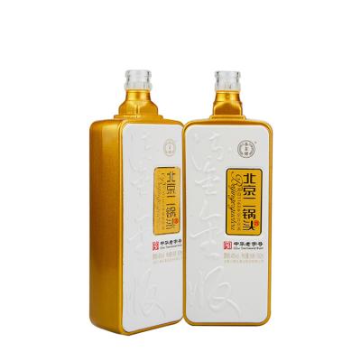 China Applique Plated Liquor Wine Storage Customs Lead Liquor Bottle Display Pet 750ml Gun Shaped Clear Glass Gold Liquor Bottle Wholesale for sale