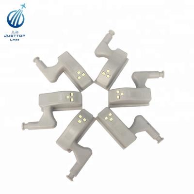 China ABS Plastic Furniture Hinge Light With Battery Wardrobe Door Cupboard Hinge Led Light for sale