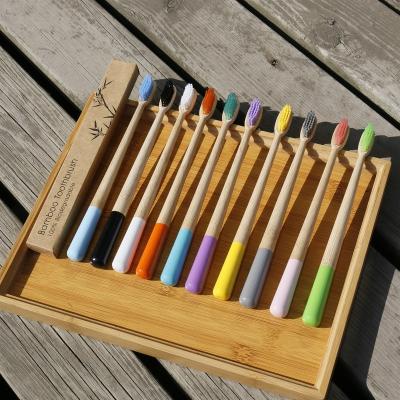 China Disposable Custom Logo Bamboo Toothbrush With Firm And Round Soft Charcoal Infused Bristles Colored for sale