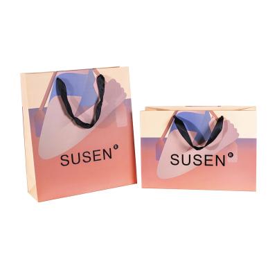 China Handmade Wholesale Gift Paper Bag Shopping Bag With Customized Logo for sale