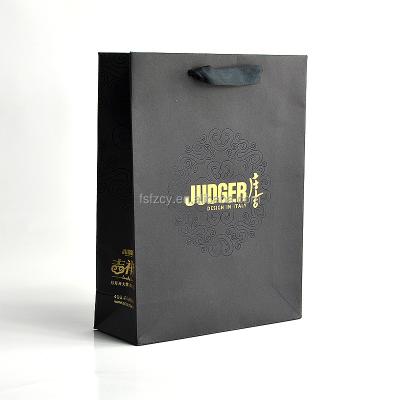 China Recycled Materials Clothing Shopping Paper Bag With High Quality Handles for sale