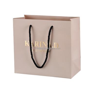 China Customized wholesale handmade custom print logo art paper shopping carrier bag jewelry gift packaging bag with handle for sale