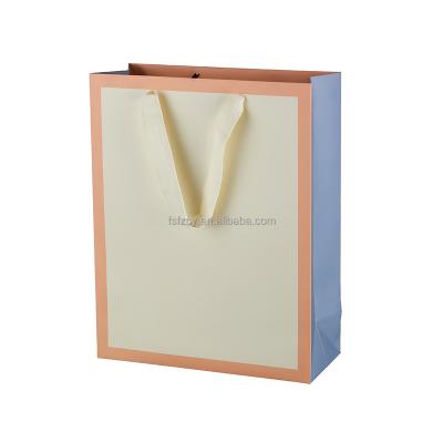 China Handmade Custom Uniquecolour Printing Brand Logo Gift Commercial Luxury Shopping Paper Bag for sale