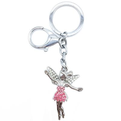 China Hot Selling Personalized Crystal Zinc Alloy Bag Charm Fashion Souvenir Rhinestone Flower Magic Key Chain Pendant Key Ring For Gift for sale