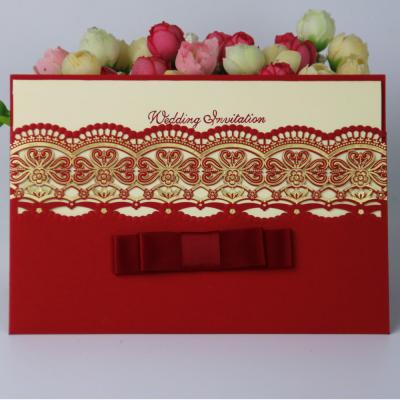 China China latest design red ivory pearl paper laser cut wedding invitation card design for sale