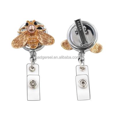 China Desktop Amazon Faux Stone Luxury Bee Card Holder YO-YO Badge Retractable Gold Reel for sale