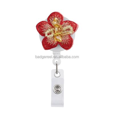 China Desktop Embroider Flower With Retractable Hand Badge Reel Crystal Yo-Yo Spin For Doctors Card Nurses Teachers Students ID for sale