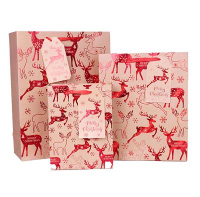 China Manufacturing Christmas Gift Recyclable Paper Bag With Ribbon Handles Custom Elks To Foil Stamping Printed Paper Bags for sale