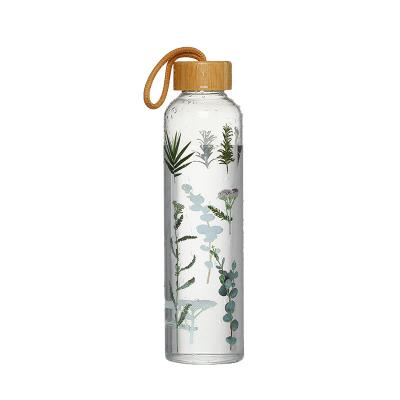 China Sustainable Customized Bamboo Cover With Rope Glass Water Bottle Wholesale Printing Glass Water Bottle for sale