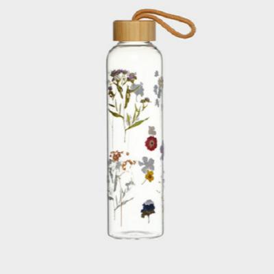 China 2022 viable new wholesale printing glass water bottle with bamboo lid for sale