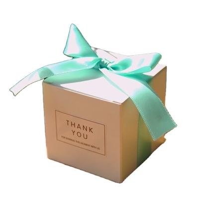 China Recyclable Simple White European Style Gift Box Baby Supplies White Candy Cube Atmosphere Style Birthday Gift Waiting Bag for sale