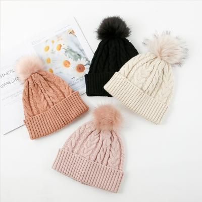 China New Winter COMMON Outdoor Acrylic Woolen Cable Ball Knitted Warm Custom Women's Knitted Hat for sale