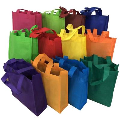 China Eco - Friendly Colorful Non Woven Gift Kids Carrying Shopping Tote Bag For Party Favor for sale