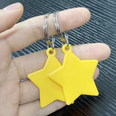 China Plastic star shaped plastic key chain with split ring, brand souvenir for exhibition, cheap key chain for sale