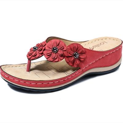 China Latest Fashion Trend Popula's Style Slippers New Flower Wedge Slippers Beach Summer Casual Wholesale Flip Flops Flip Flops for Women for sale