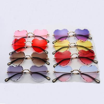 China Fashion Women Sunglasses Women Shape Lovely Cute Girls Heart Rimless Sunglasses Eyewear Glasses 0045 for sale