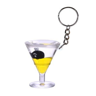 China Custom Creative Plastic Graduation Gift Backpack Car Accessories Charm Glass Acrylic Cute Pedant Wine Liquid Key Chain for sale