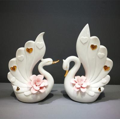 China Customized Eco-friendly Ceramic Swan Figurine Hollow China Decoration Indoor Flower Vase For Wedding for sale