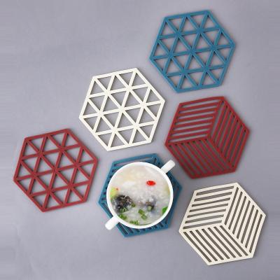 China Viable Creative Hexagonal Hollow Coaster Household Protective Insulation Non-Slip Teapot Mat Bowl Table Table Anti-scalding Mat for sale