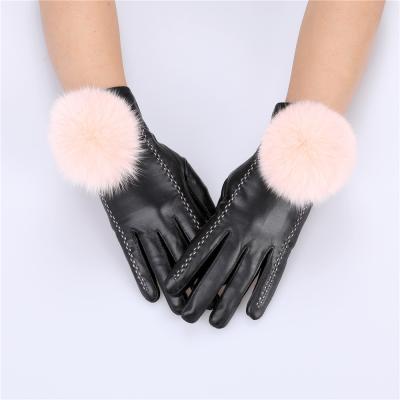 China Quality Windproof Women's Plus Size Sheepskin Leather Winter Genuine Gloves With Fox Fur Pom Poms Fleece Lined for sale