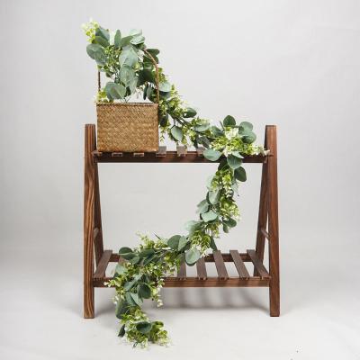 China Anti-UV Artificial Plant Vines Wall Hanging Rattan Leaves Branches Vine Plastic Outdoor Garden PE Eucalyptus Home Decoration for sale