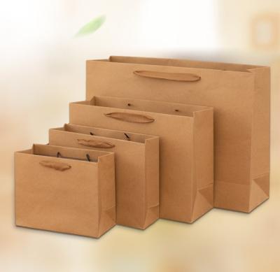 China Recycled Materials Wholesale Gift Wrapping Paper Bag Clothing Packaging Bag Thickened Gift Wrapping Takeaway Shopping Bag for sale