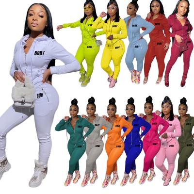 China Factory direct sales breathable monograph slim leisure pocket zipper solid color personality printed jogging suits two-piece set sports for sale