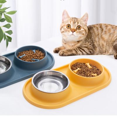 China Dog Feeder Pet Water And Food Double Bowl Set Slow Feeder Blow Up Stop Puzzle Pet Bowl With No-puddle for sale