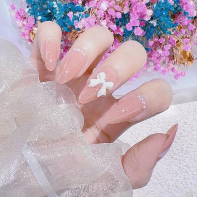 China Easy Apply SanLong 24 Nails Almond Shape  Pearl bow decoration Supplies  Nude Nails Acrylic Press On Nail Set for sale